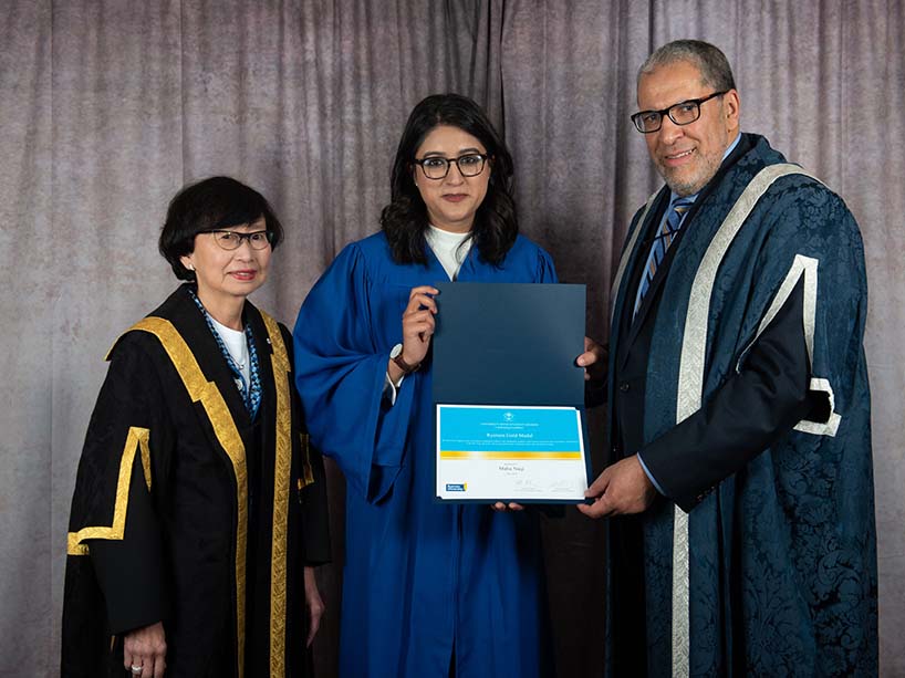 President Mohamed Lachemi and Gold Medal recipient Maha Naqi holding the Gold Medal award.