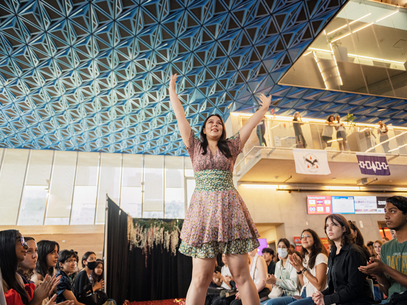 Student models poses on the runway