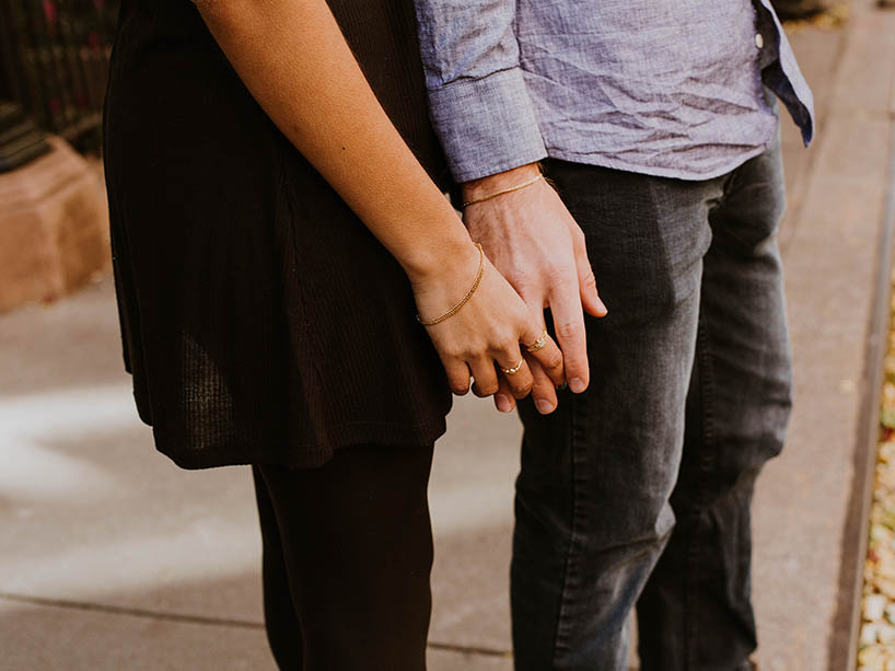 Two people holding hands.