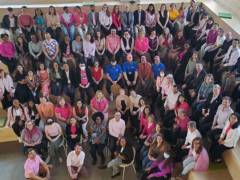 TMU community in their pink shirts on campus. 