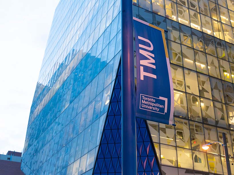 The Student Learning Building with a TMU sign in front. 