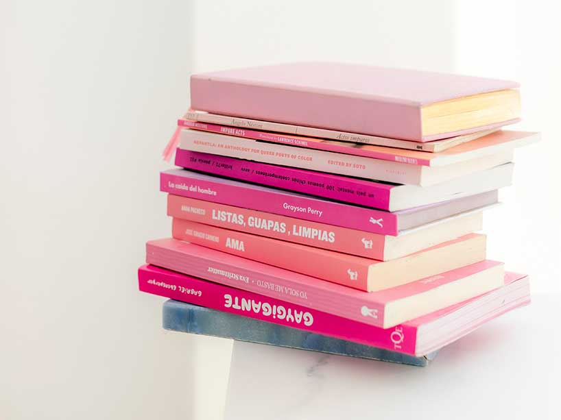 A stack of pink books.