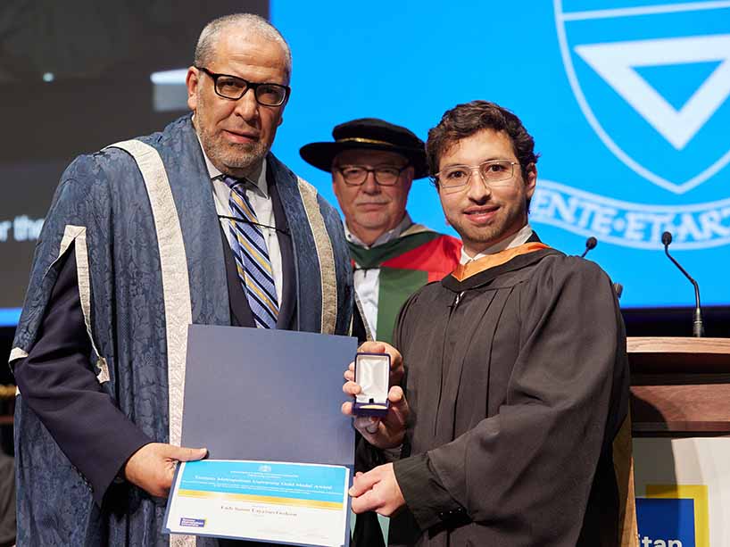 Fadi Samir Layyous Gedeon receives his Gold Medal award from President Mohamed Lachemi at the Fall 2023 convocation ceremonies.