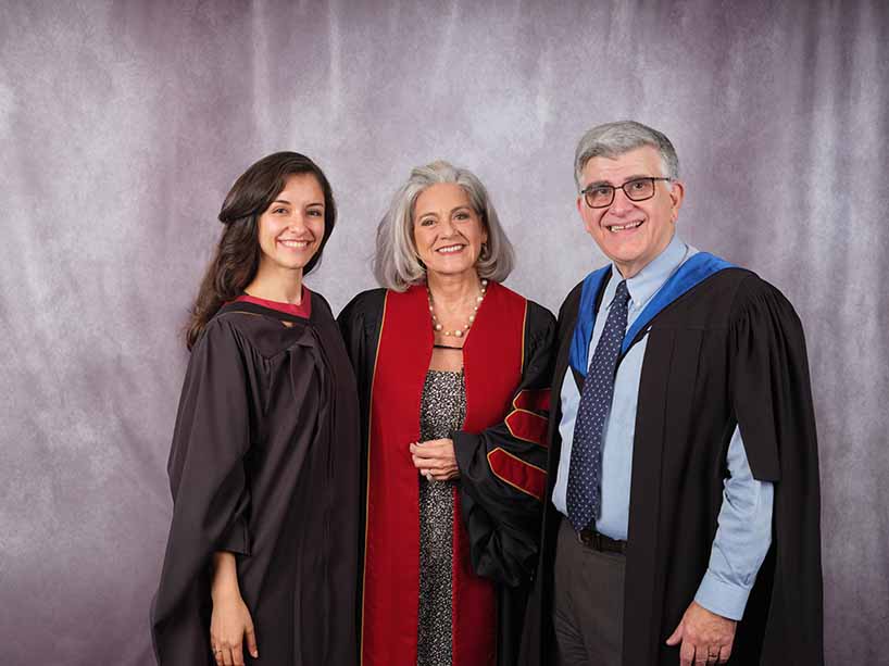 Journalism graduate and Gold Medal winner Mahdis Habibinia, left, stands with renowned Canadian journalist and honorary doctorate recipient Lisa LaFlamme, centre, and Charles Falzon, Dean of The Creative School.