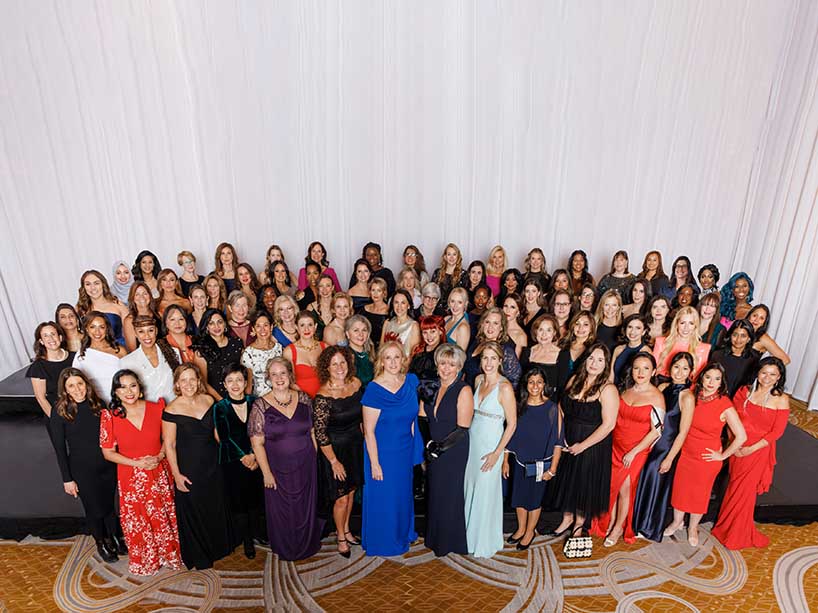 A group of women standing together for a photo.