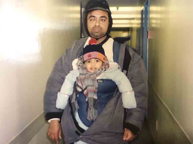 ricamalan Pathmanathan and his son Ajeyram in a baby carrier