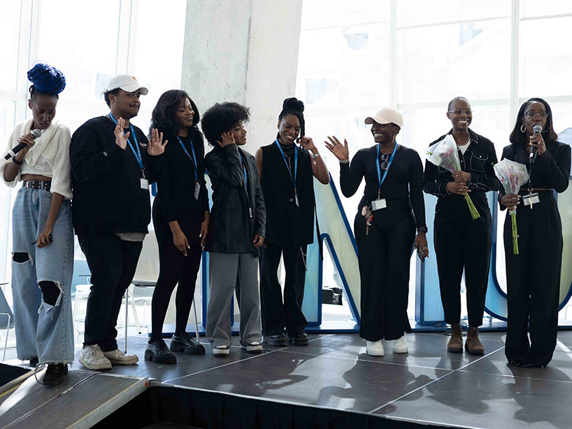 A group of Black students on stage.