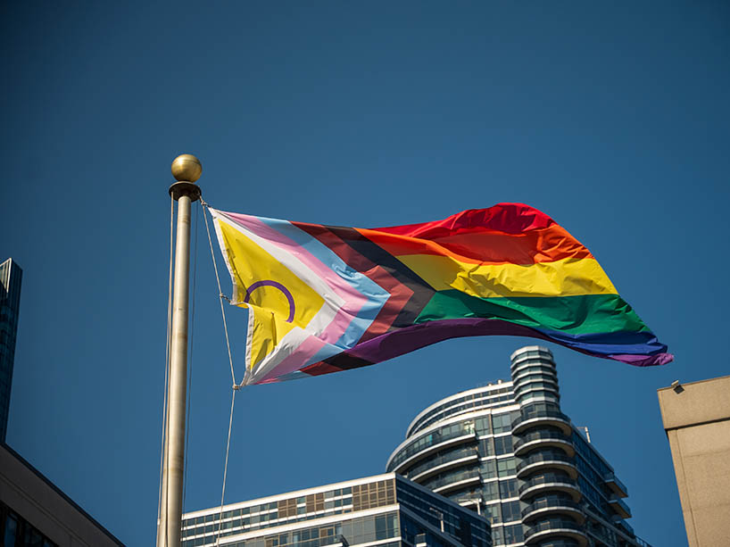 The Pride flag blowing in the wind.