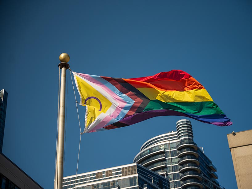 The Pride flag blowing in the wind.