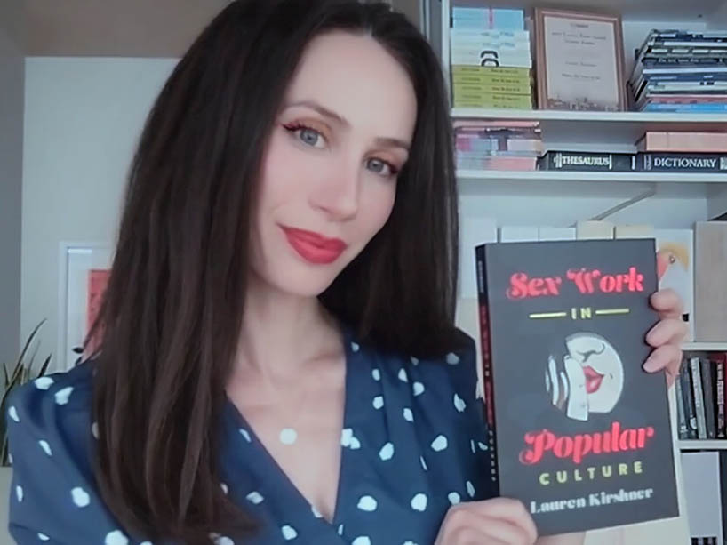 Professor Lauren Kirshner holding her new book title Sex Work in Popular Culture.