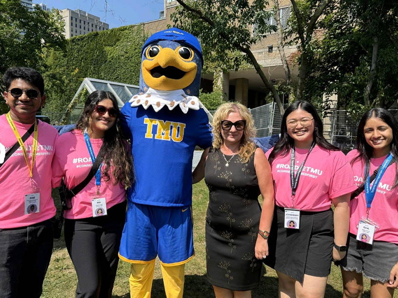 Members of the TMU orientation team and mascot.