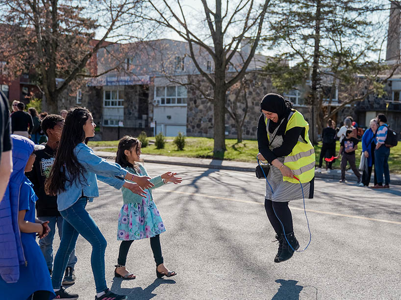 Children play on a street that is closed to cars.