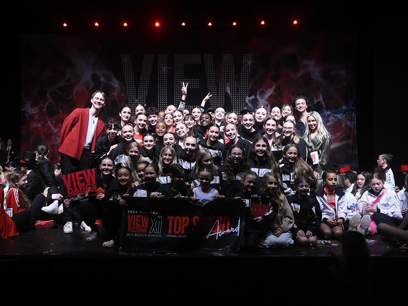 Creative Industries student Josh Hoven poses for a group photo with dancers from "Forward Dance Academy" at an Ottawa competition this past spring.