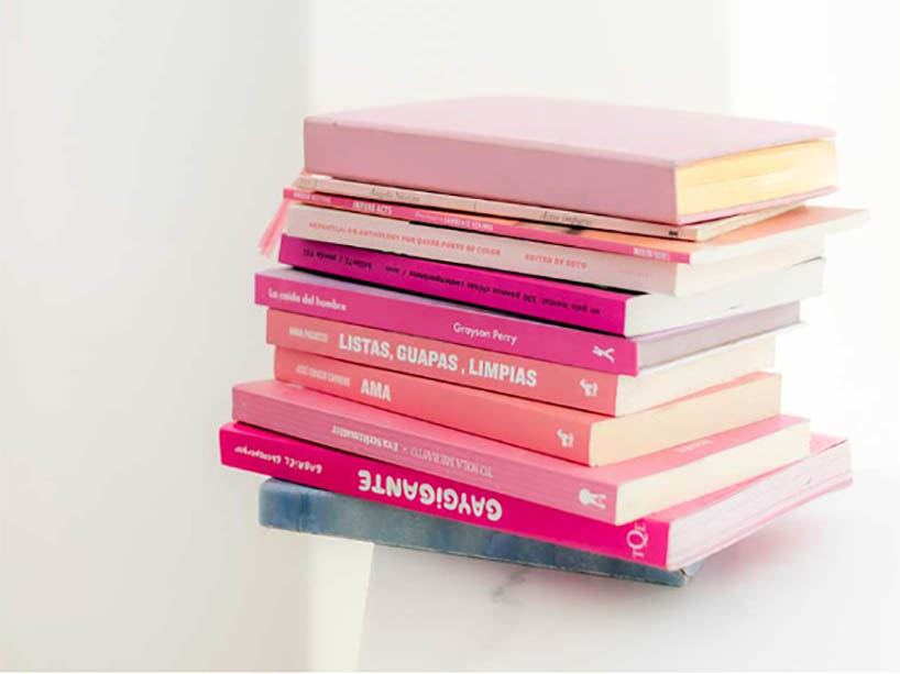 A stack of pink books. 