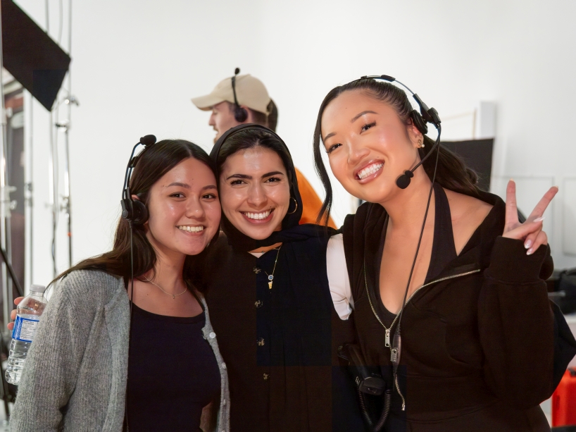 Three female producers pose for a photo on the set of a partner production with MLSE.