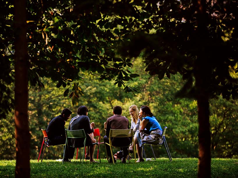 Group of students gathering and talking in the Kerr Hall Quad.