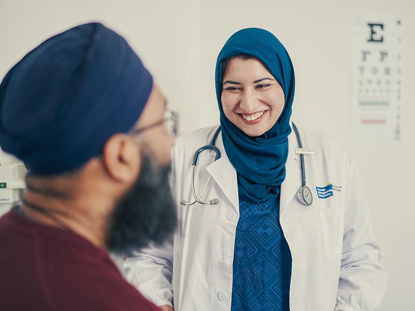 A doctor talking to a patient.