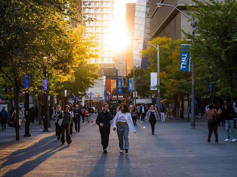  Students walking on campus. 