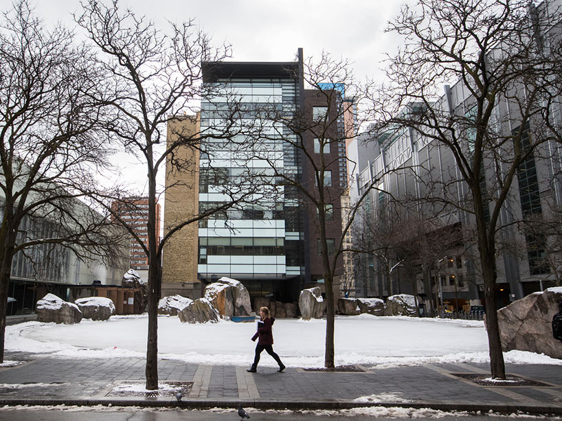 A person walks by Lake Devo on a snowy day.