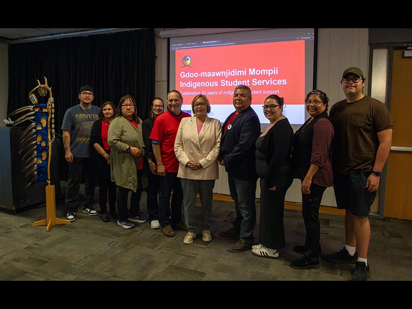 GMISS staff stand with Director of Indigenous Initiatives and GMISS founder Monica McKay at the centre.