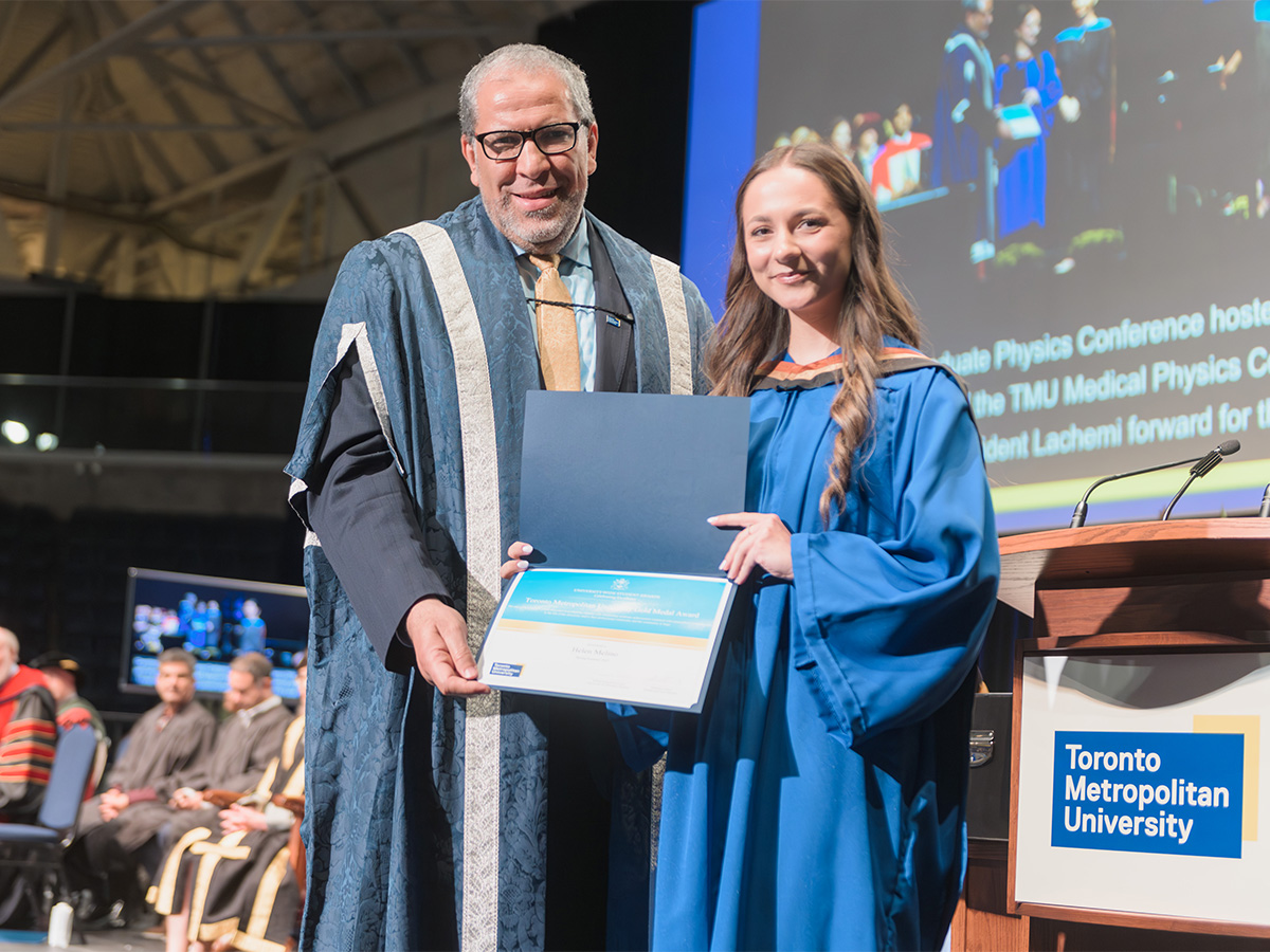 Helen Melino and Mohamed Lachemi holding the Gold Medal certificate at convocation 