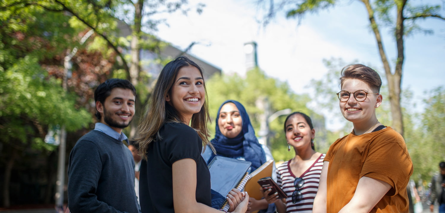 A group of students smiling at the camera