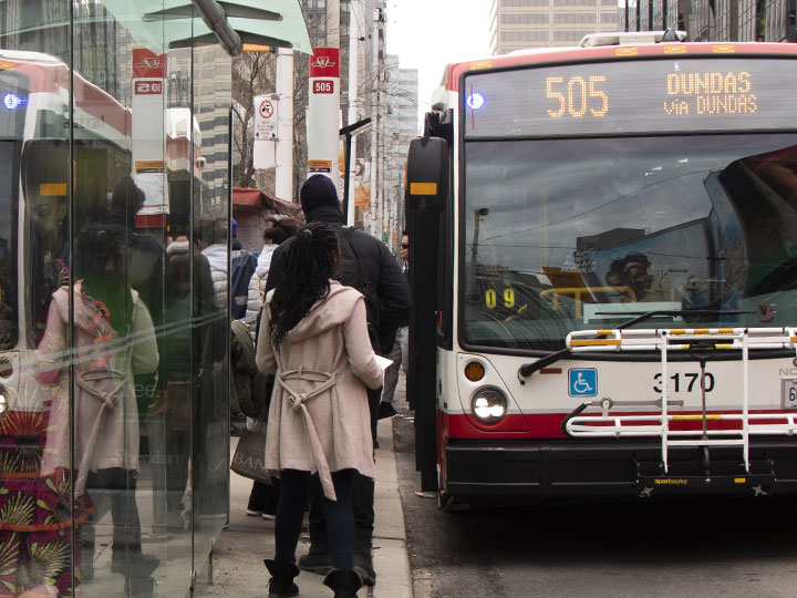 People boarding a 505 Dundas bus.
