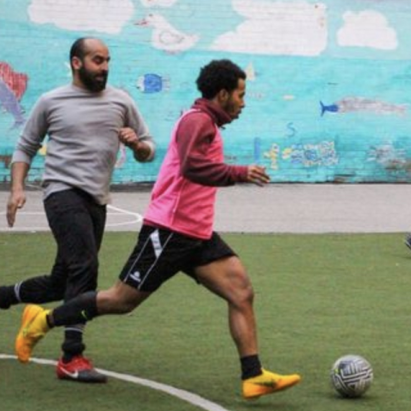 two men playing soccer