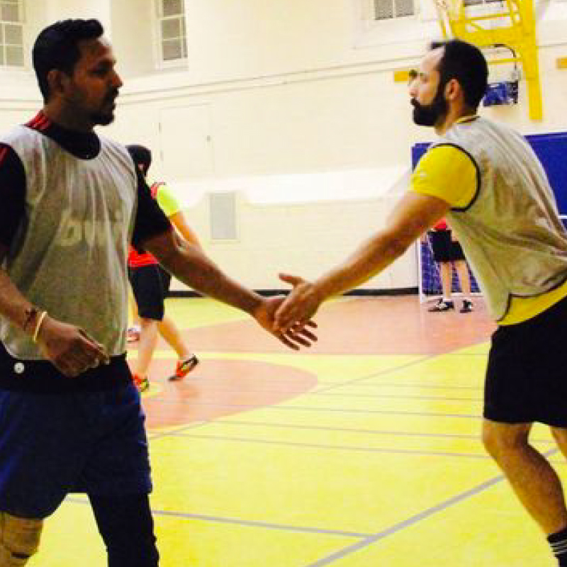 two men playing basketball