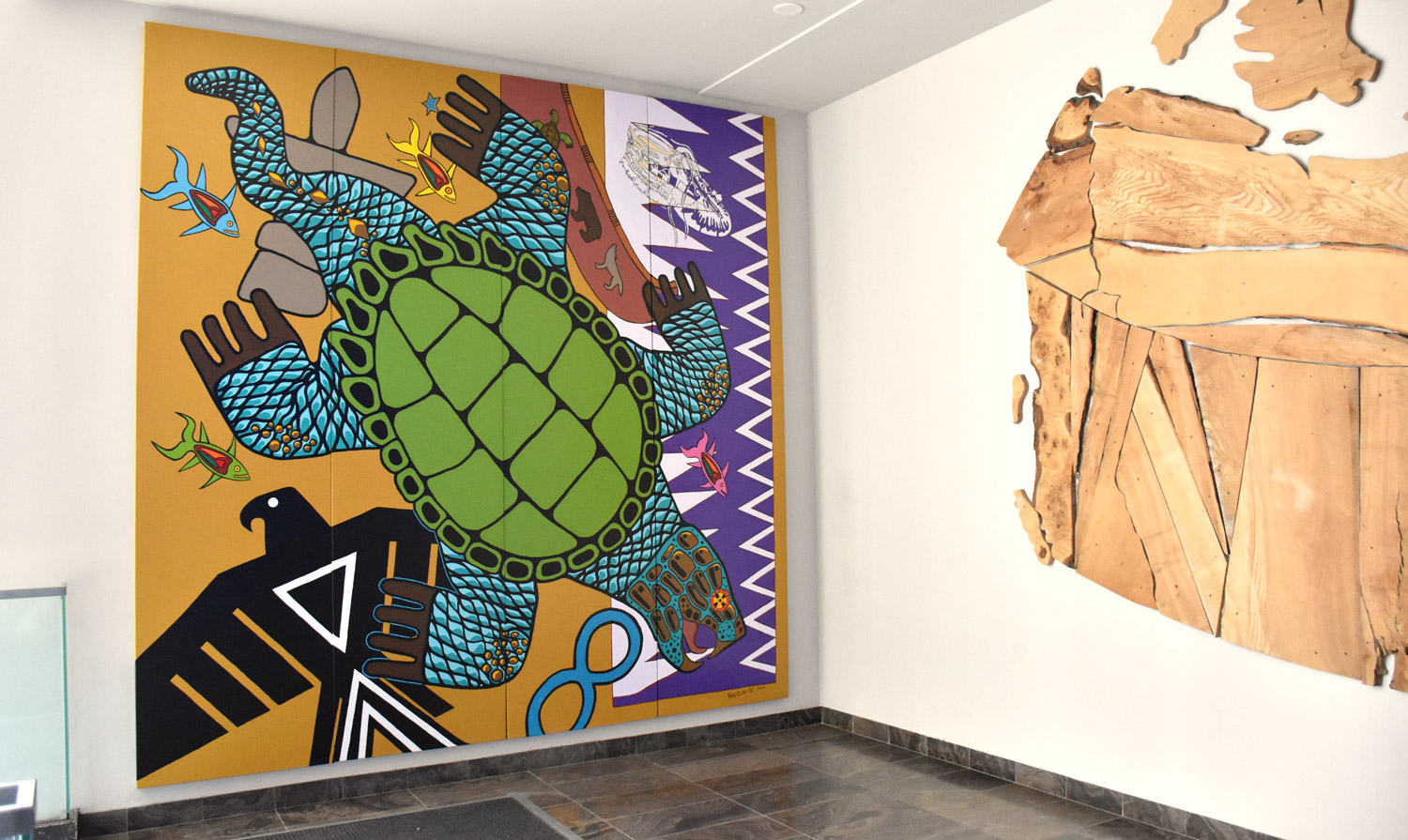 Photo of the hallway wall where the mural artwork by Philip Cote is displayed