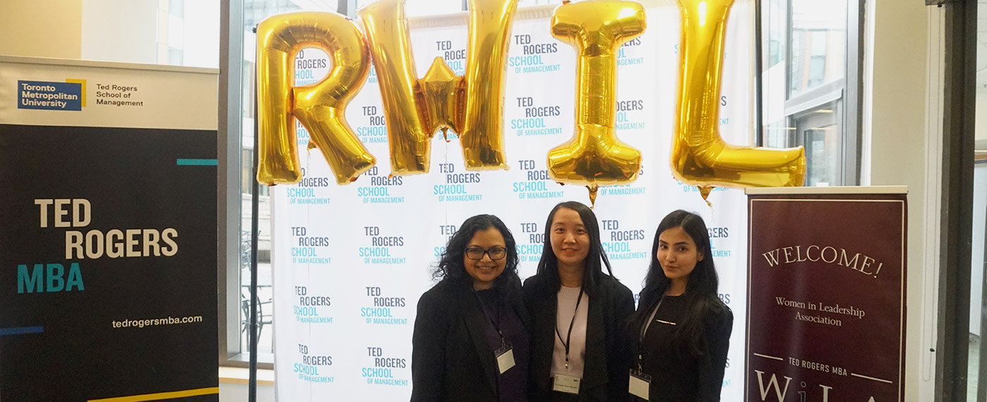 Three female participants of the Case Competition at the ReImagine Women in Leadership conference 