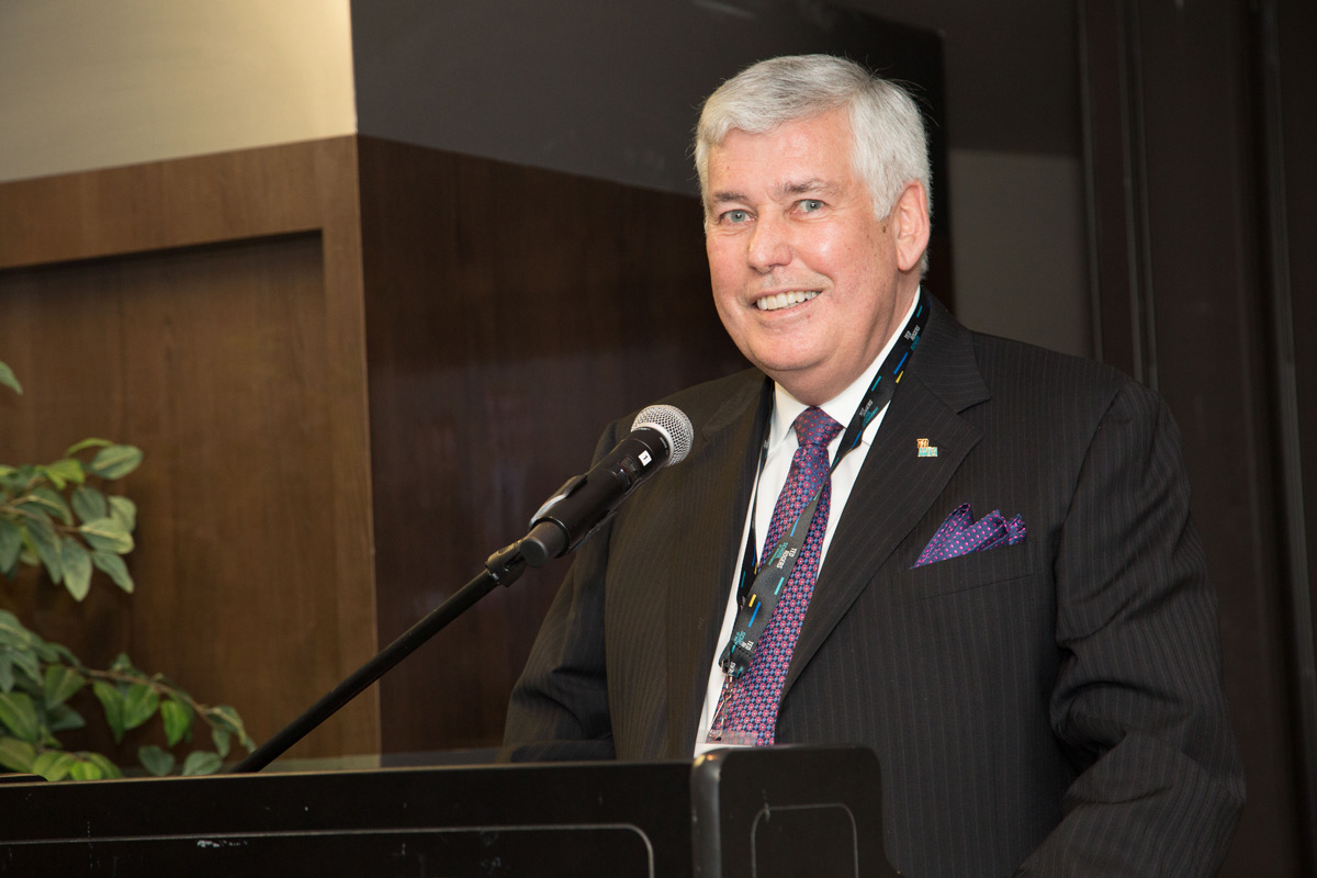 Dale Carl at the podium during an event