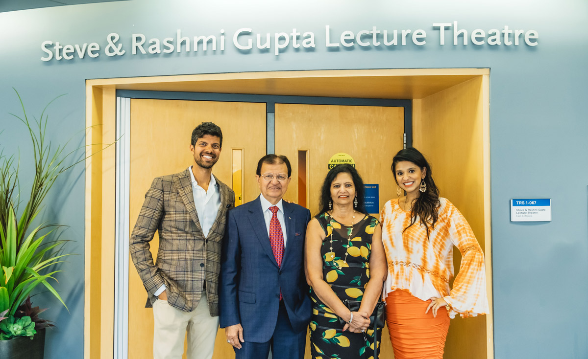 Members of the Gupta family in front of the Steve & Rashmi Gupta Lecture Theatre