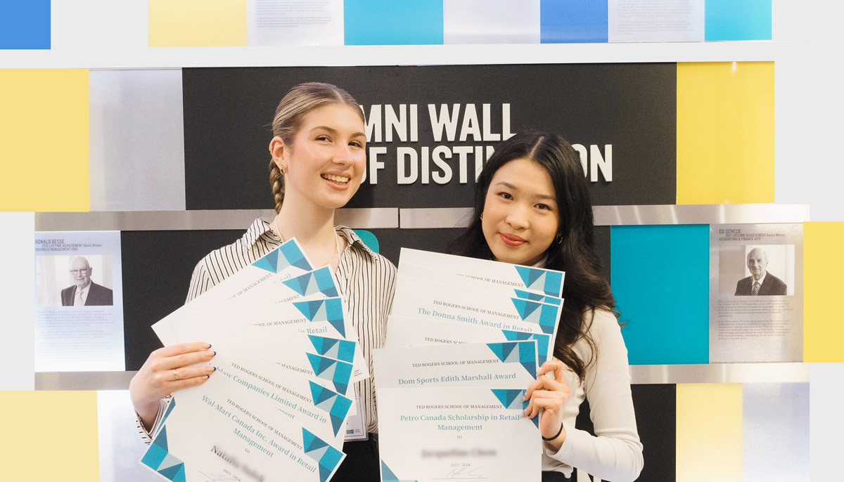 Two students holding their award certificates