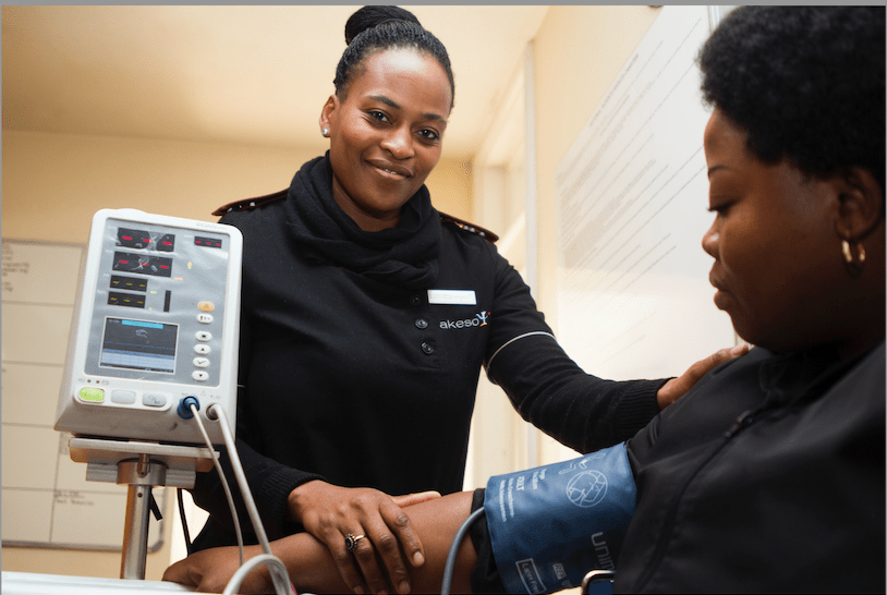 Paramedic taking a patients’ blood pressure