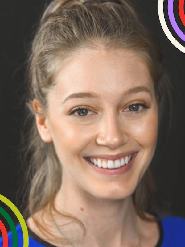 Light haird woman with her hair pulled back smiles at the camera