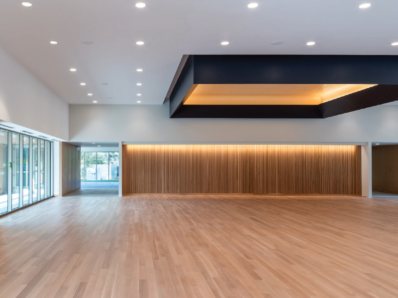 Central banquet hall embellished with light oak wood floors adding a sense of warmth and comfort to the space