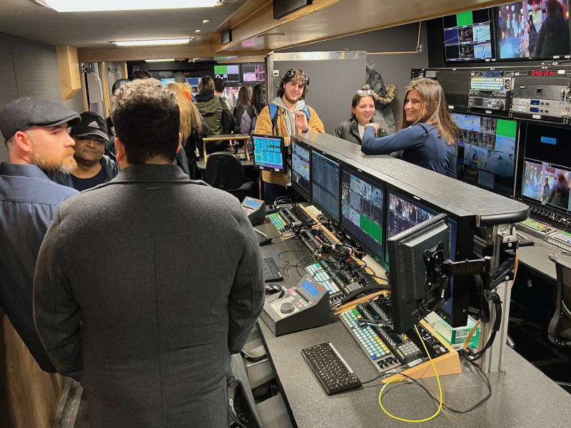 Taylor Gordan, Dome Engineer and RTA alum, speaking to a group of students, faculty, and staff in the Dome mobile production truck