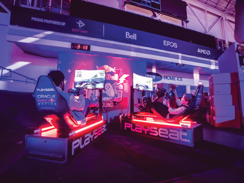 Overwatch League event goers game on the sidelines, enjoying access to gaming equipment generously provided by brand partners