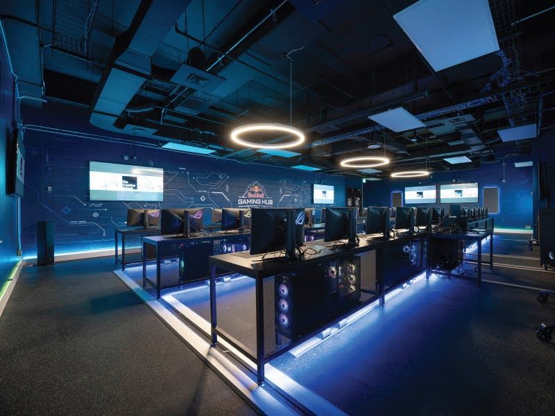 Large gaming room with monitors and computers in rows