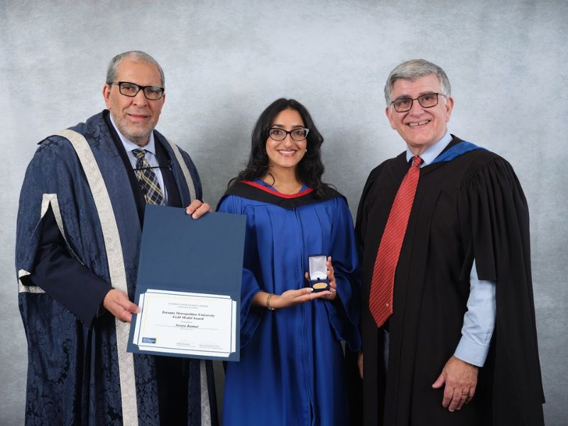 Aanya Kumar (middle) with Dr. Mohamed Lachemi, President and Vice-Cancellor of Toronto Metropolitan University (left), and Charles Falzon, Dean of The Creative School (right)