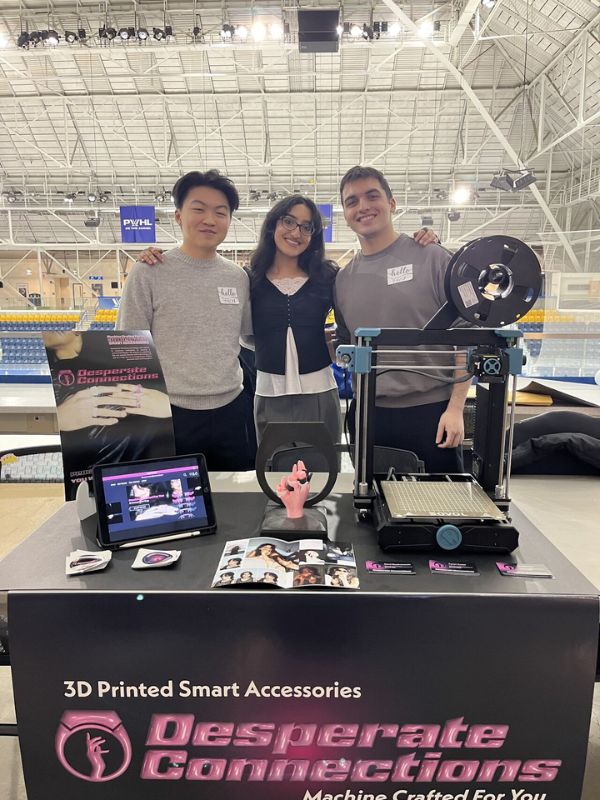 Aanya Kumar with teammates Jacob Chan and David Quattrociocchi presenting their undergraduate capstone project