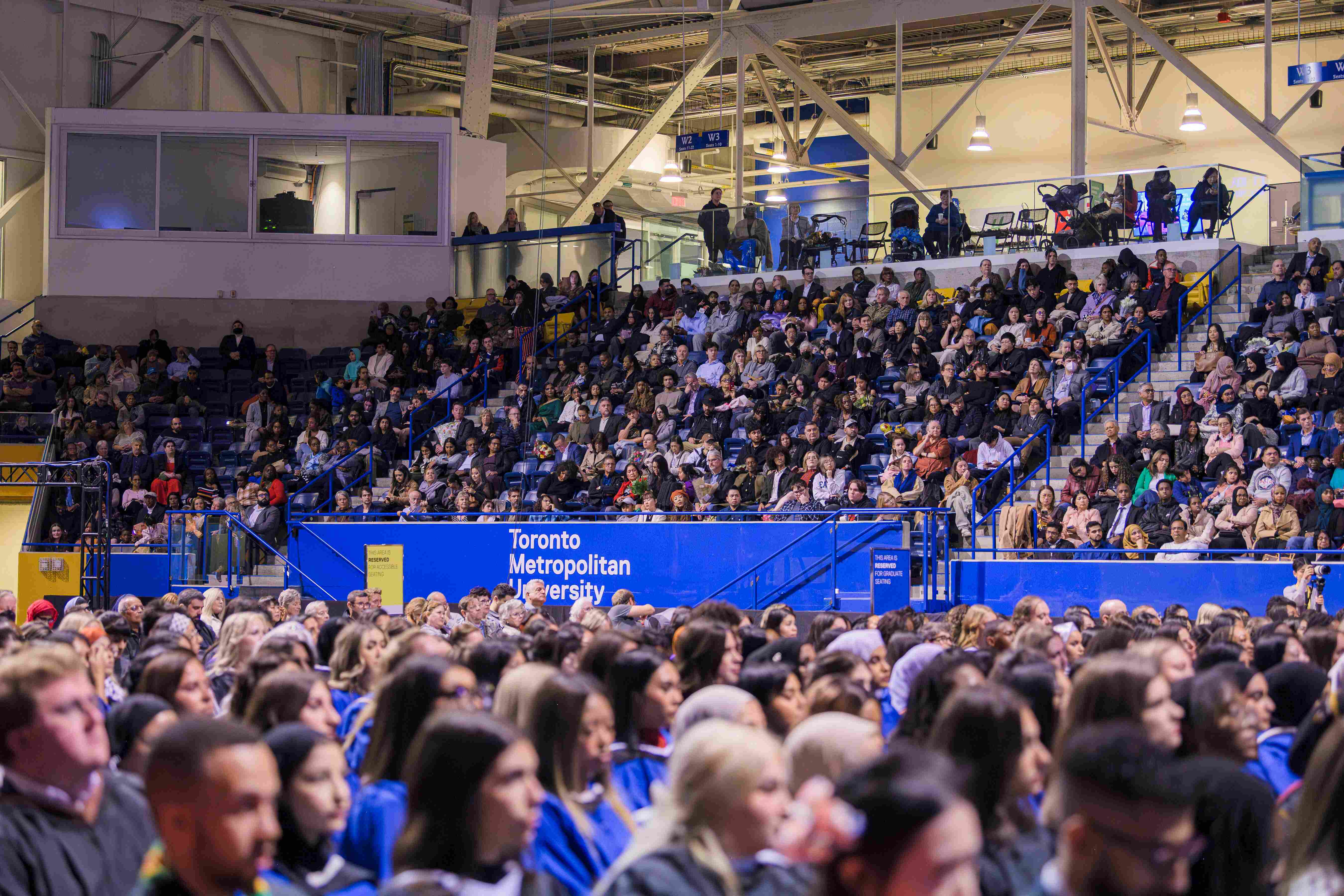 Graduands and guests seated at a convocation ceremony.