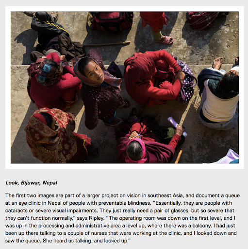 A queue of people waiting for medical treatment in Nepal, with one woman looking up to the camera.